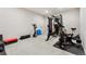 A home gym features modern fitness equipment including a weight machine and exercise bike at 10968 Lewiston St, Commerce City, CO 80022