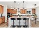 Contemporary kitchen featuring a large island, pendant lighting, and stainless steel appliances at 10968 Lewiston St, Commerce City, CO 80022