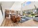 Bright living room with high ceilings, natural light, and open layout to kitchen and backyard at 10968 Lewiston St, Commerce City, CO 80022