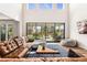 Spacious living room with high ceilings, large sliding glass doors opening to the patio at 10968 Lewiston St, Commerce City, CO 80022