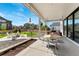 Covered patio offers an outdoor dining space and a cozy fire pit area at 10968 Lewiston St, Commerce City, CO 80022