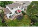 Aerial view of backyard with a deck, outdoor seating, a trampoline, and lush green grass at 10137 W Berry Dr, Littleton, CO 80127