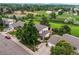 Aerial view showcases a well-maintained home with mature trees and landscaping in a desirable neighborhood at 10137 W Berry Dr, Littleton, CO 80127