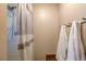Bathroom featuring tiled shower and rack to hold fresh, clean towels at 10137 W Berry Dr, Littleton, CO 80127