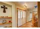 Inviting entryway boasts tile floors, a skylight, decorative shelves and a beautiful door at 10137 W Berry Dr, Littleton, CO 80127