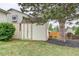 View of a white storage shed in the backyard next to a shade tree and mulch at 10137 W Berry Dr, Littleton, CO 80127