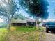 Charming two-story home with brick accents, mature trees, and a welcoming front porch at 2281 Fairplay St, Aurora, CO 80011