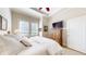 Relaxing bedroom with plush bedding, shuttered windows, and modern ceiling fan at 7600 Landmark Way # 613-2, Greenwood Village, CO 80111