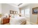 Bright bedroom with shuttered windows, a comfortable bed with fresh white linens, and elegant decor at 7600 Landmark Way # 613-2, Englewood, CO 80111