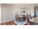 Elegant dining room with a large wooden table, chandelier, and hardwood flooring at 7600 Landmark Way # 613-2, Greenwood Village, CO 80111
