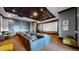 A luxury home theater is equipped with comfortable seating and state-of-the-art audio-visual technology at 7600 Landmark Way # 613-2, Greenwood Village, CO 80111