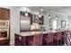 Modern kitchen features granite countertops, stainless steel appliances, and stylish pendant lighting at 7600 Landmark Way # 613-2, Greenwood Village, CO 80111