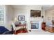 Inviting living room featuring a fireplace and hardwood floors with a desk in a sitting area at 7600 Landmark Way # 613-2, Greenwood Village, CO 80111