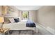 Relaxing bedroom with soft carpet, neutral tones, natural light, and a cozy ambiance at 7369 S Gore Range Rd # 208, Littleton, CO 80127