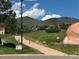 Scenic view of walking path with mountain views, showcasing a home's access to outdoor recreation at 7369 S Gore Range Rd # 208, Littleton, CO 80127