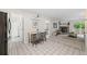 Bright dining area adjacent to a living room and kitchen at 7369 S Gore Range Rd # 208, Littleton, CO 80127
