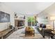 Comfortable living room with fireplace and sliding glass door leading to outdoor area at 7369 S Gore Range Rd # 208, Littleton, CO 80127