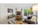 Comfortable living room with fireplace and sliding glass door leading to outdoor area at 7369 S Gore Range Rd # 208, Littleton, CO 80127