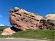Unique Red Rocks landscape with green grass, and blue sky for a beautiful surrounding at 7369 S Gore Range Rd # 208, Littleton, CO 80127