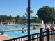 Community swimming pool with lounge chairs and clear water, perfect for summer relaxation at 7369 S Gore Range Rd # 208, Littleton, CO 80127