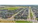 Expansive aerial view of a residential community with parks, schools, and greenbelts at 5925 Hanover St, Denver, CO 80238