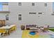 Back patio with table, chairs, and outdoor sofa provides an ideal relaxation spot at 5925 Hanover St, Denver, CO 80238