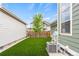 Private backyard features artificial turf and a playhouse at 5925 Hanover St, Denver, CO 80238