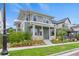 Charming two-story home with a well-manicured lawn and inviting front porch at 5925 Hanover St, Denver, CO 80238
