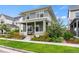 Charming home featuring a covered front porch with seating and well-maintained landscaping at 5925 Hanover St, Denver, CO 80238