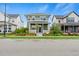 Inviting two-story home with a charming front porch and professionally landscaped yard at 5925 Hanover St, Denver, CO 80238