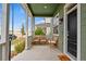 Inviting front porch with comfortable seating, perfect for enjoying the outdoors at 5925 Hanover St, Denver, CO 80238