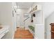 Spacious entryway features hardwood floors, built-in storage, and coat rack at 5925 Hanover St, Denver, CO 80238