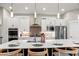 Contemporary kitchen showcases stainless appliances, quartz countertops, and stylish pendant lighting at 5925 Hanover St, Denver, CO 80238