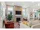 Inviting living room showcasing a modern fireplace with stylish decor and natural light at 5925 Hanover St, Denver, CO 80238