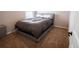 Well-lit bedroom with plush carpeting, neutral walls, and a comfortable bed at 676 Hearthstone Ave, Brighton, CO 80601