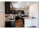 Well-equipped kitchen boasts stainless steel appliances, granite counters, and stylish cabinetry at 676 Hearthstone Ave, Brighton, CO 80601