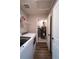 A well-lit laundry room with a washing machine, dryer, and a separate utility closet featuring a water heater at 676 Hearthstone Ave, Brighton, CO 80601