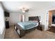 Comfortable main bedroom with ceiling fan, good natural light and ensuite bathroom at 676 Hearthstone Ave, Brighton, CO 80601