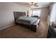 Spacious main bedroom featuring neutral tones, a ceiling fan, and ample natural light at 676 Hearthstone Ave, Brighton, CO 80601