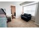 Bright main bedroom with sitting area and an ensuite bathroom at 676 Hearthstone Ave, Brighton, CO 80601