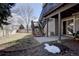 Landscaped backyard with access to the walkout basement and yard at 14656 W Vassar Dr, Lakewood, CO 80228