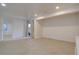 Finished basement area with neutral carpeting, a large window, and recessed lights at 14656 W Vassar Dr, Lakewood, CO 80228