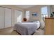Bright bedroom with a large window and a comfortable bed at 14656 W Vassar Dr, Lakewood, CO 80228