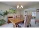 Elegant dining room with a chandelier, large table, and stylish seating at 14656 W Vassar Dr, Lakewood, CO 80228