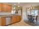 Bright eat-in kitchen features granite countertops, stainless steel appliances, and a cozy breakfast nook at 14656 W Vassar Dr, Lakewood, CO 80228