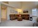 Inviting living room with vaulted ceilings, plush seating, and natural light from clerestory windows at 14656 W Vassar Dr, Lakewood, CO 80228