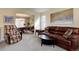 Warm and inviting living room featuring neutral colors, comfortable seating, and elegant decor at 14656 W Vassar Dr, Lakewood, CO 80228