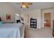 Spacious main bedroom showing ensuite bathroom and staircase to the upper floor at 14656 W Vassar Dr, Lakewood, CO 80228