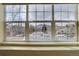 A large window provides neighborhood views with mountains in the distance at 14656 W Vassar Dr, Lakewood, CO 80228