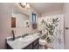 Compact bathroom with a granite-look countertop and leaf-patterned shower curtain at 9556 W 89Th Cir, Broomfield, CO 80021